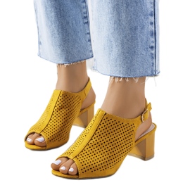 Yellow openwork sandals on a Belinda post