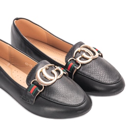 Black loafers with a gold Dreyer buckle