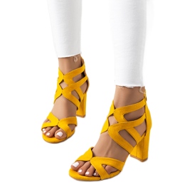 Yellow sandals on a Maddox post