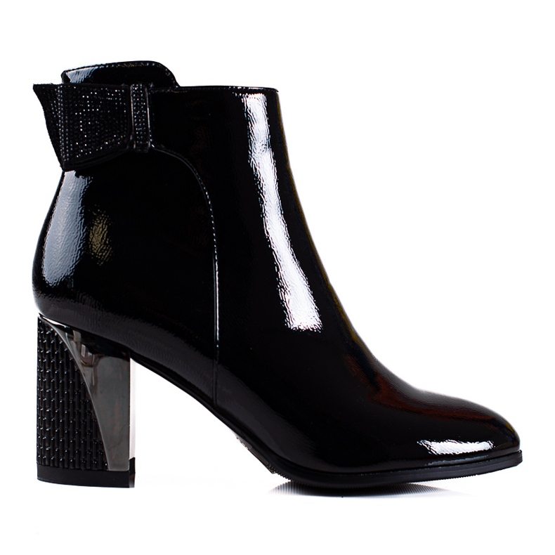 Elegant women's Shelovet boots on a decorative black post