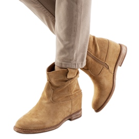 Dark beige boots on an indoor Hunjet wedge heel