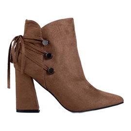 T.Sokolski Brown women's boots on the Sokolski post with a decorative ribbon