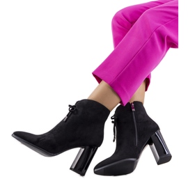 Black ankle boots on the Deti post