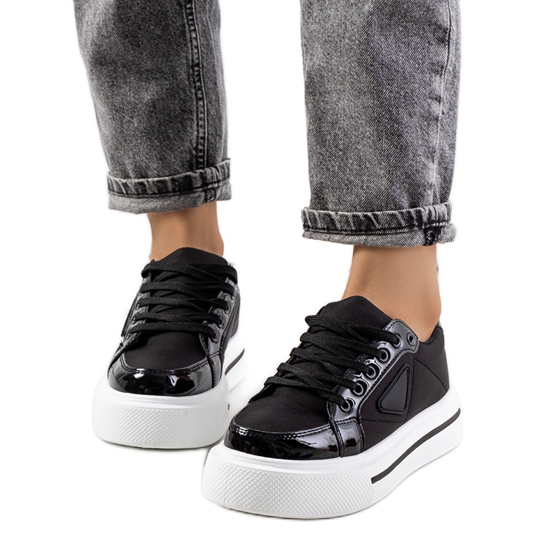 Black sneakers with a thick Scrabster sole