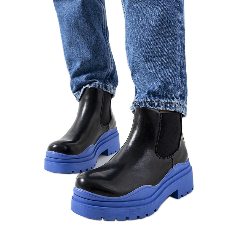 Black boots on the blue Gaffney platform