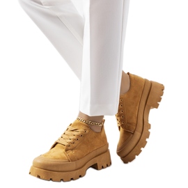 Brown sneakers on the Dearth platform