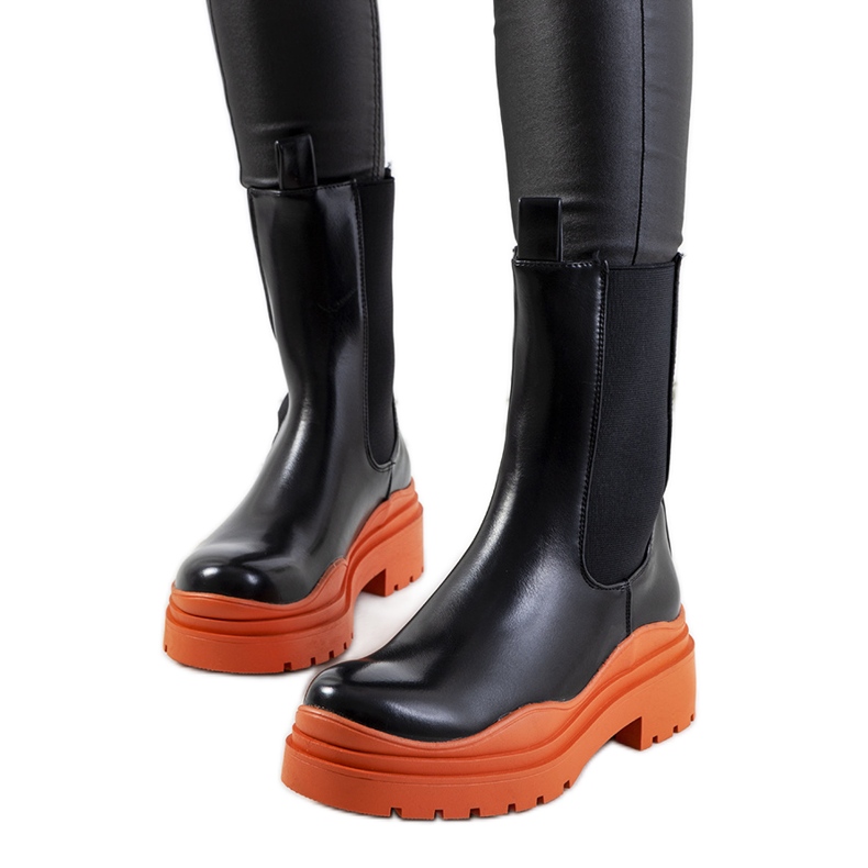 Black ankle boots with an orange Nester sole Black ankle boots with an orange Nester sole