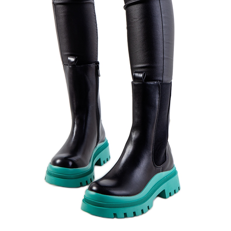 PA1 Black boots on the green Ruket platform