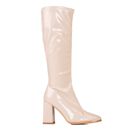 Women's boots on the Shelovet post made of varnished ecological leather beige
