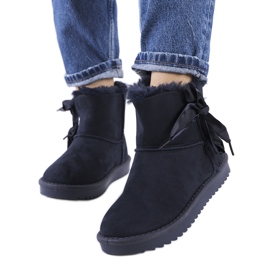 Navy blue snow boots with a Lachance bow