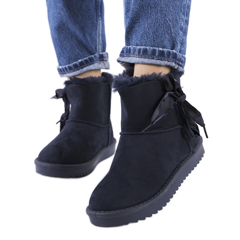 Navy blue snow boots with a Lachance bow