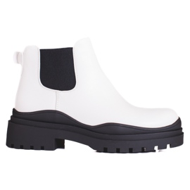 Black and white women's Chelsea boots on the platform