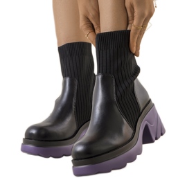 Black boots with a purple Tomlin sole