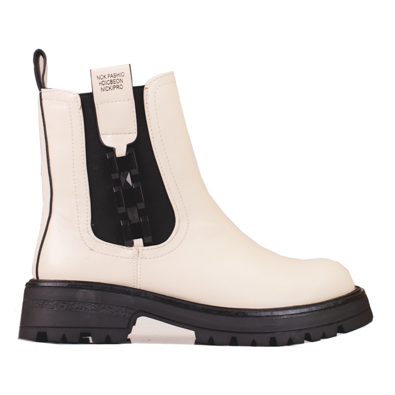 Cream women's Chelsea boots with a black sole beige