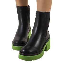 PA1 Black ankle boots on the green Torrela platform