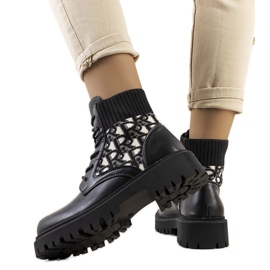 Black boots with a flexible upper beige Black boots with a flexible upper beige