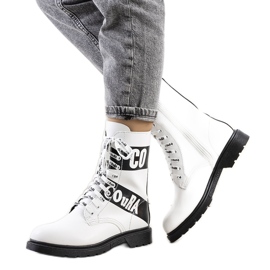 White hiking boots decorated with inscriptions