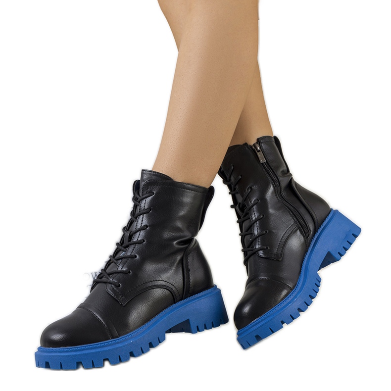 Black boots on a blue Rukit sole