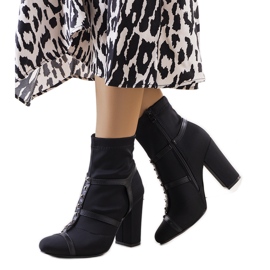 Black boots on the Dagma post