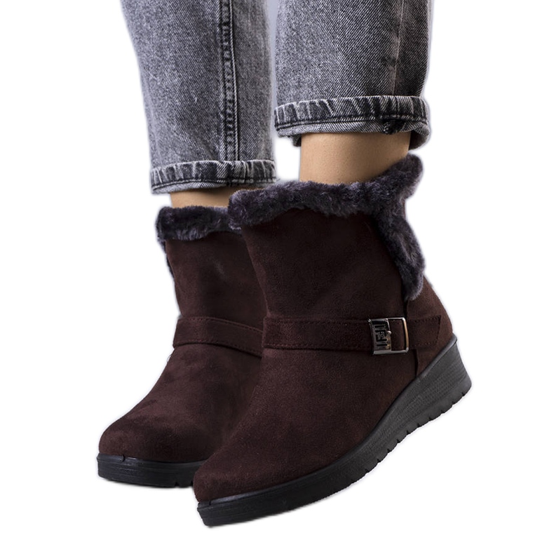 Brown insulated boots on a Capo wedge