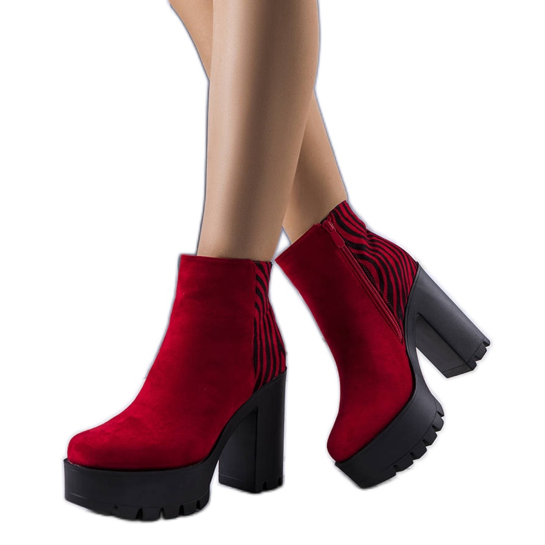 BM Red ankle boots on a high Khalid post