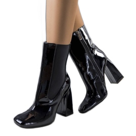 Black patent ankle boots on the Viridia post