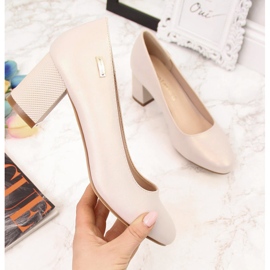 Pearl beige pumps on a decorative post from Sergio Leone
