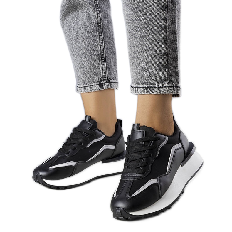 Black sneakers on the Ada platform