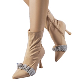 Beige boots decorated with rhinestones from Caisse Beige boots decorated with rhinestones from Caisse