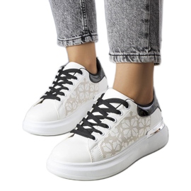 Black and white sneakers decorated with perforations from Erin Black and white sneakers decorated with perforations from Erin
