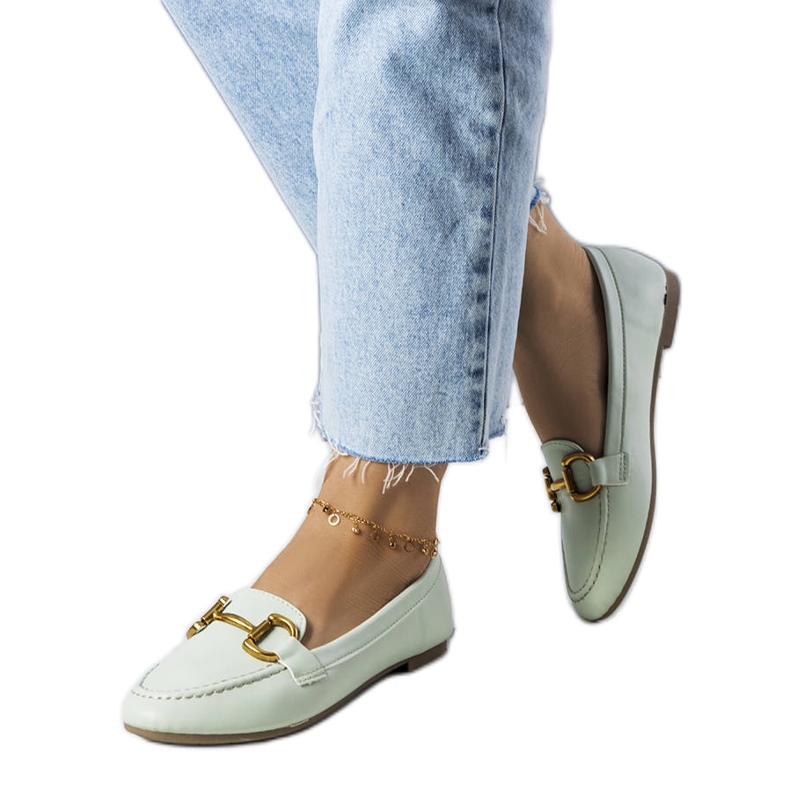 Green loafers with gold embellishment from Regina