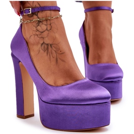 Fashionable pumps on a high pillar purple
