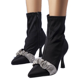 Black boots decorated with Caisse rhinestones