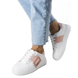 White sneakers decorated with a pink Toni buckle