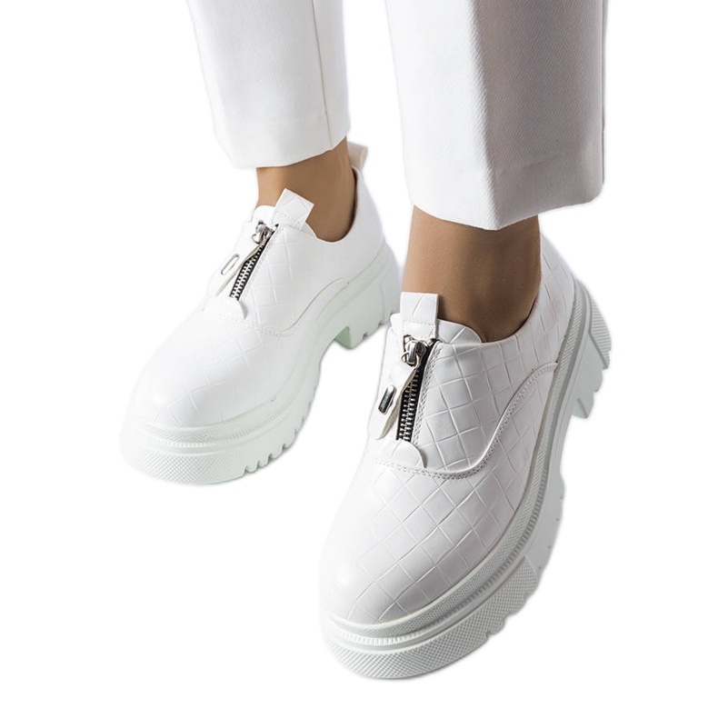 White brogues decorated with Travers embossing