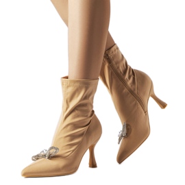 Beige boots decorated with a zircon Mars bow Beige boots decorated with a zircon Mars bow
