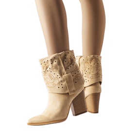 Beige cowboy boots with openwork uppers from Guibord Beige cowboy boots with openwork uppers from Guibord