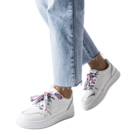 White sneakers tied with Pryor ribbon