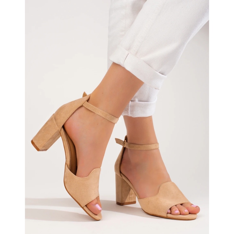 Women's beige sandals on the post by W. Potocki