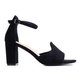 Black women's sandals on the post by W. Potocki Black women's sandals on the post by W. Potocki