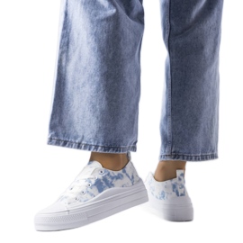 White sneakers with a blue accent from Blais White sneakers with a blue accent from Blais