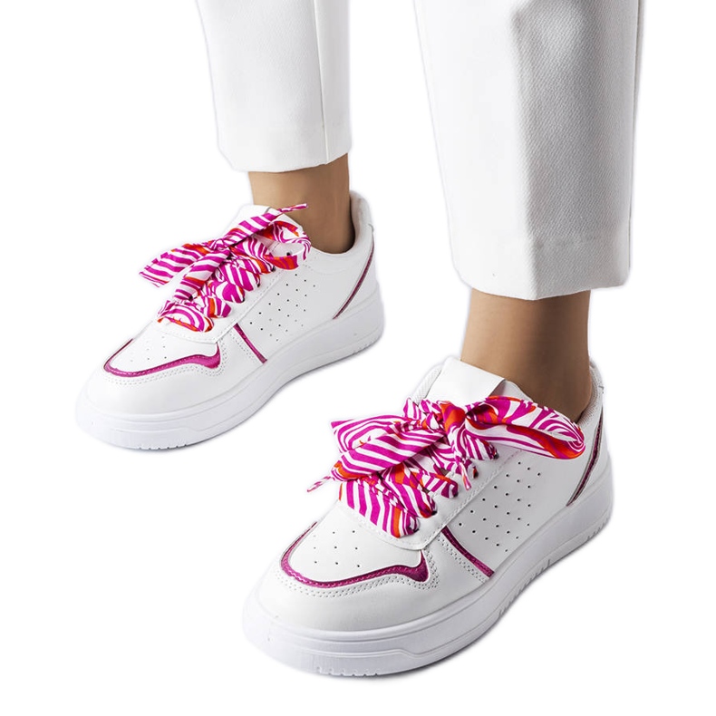White sneakers tied with Pryor ribbon