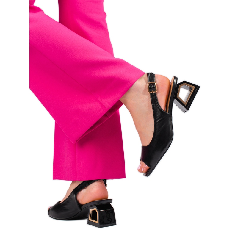 Black sandals with a low decorative heel from Vinceza