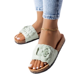 Green sandals decorated with a Desaulniers flower
