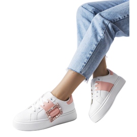 White sneakers decorated with a pink Ike buckle