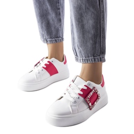 White sneakers decorated with a pink Ike buckle