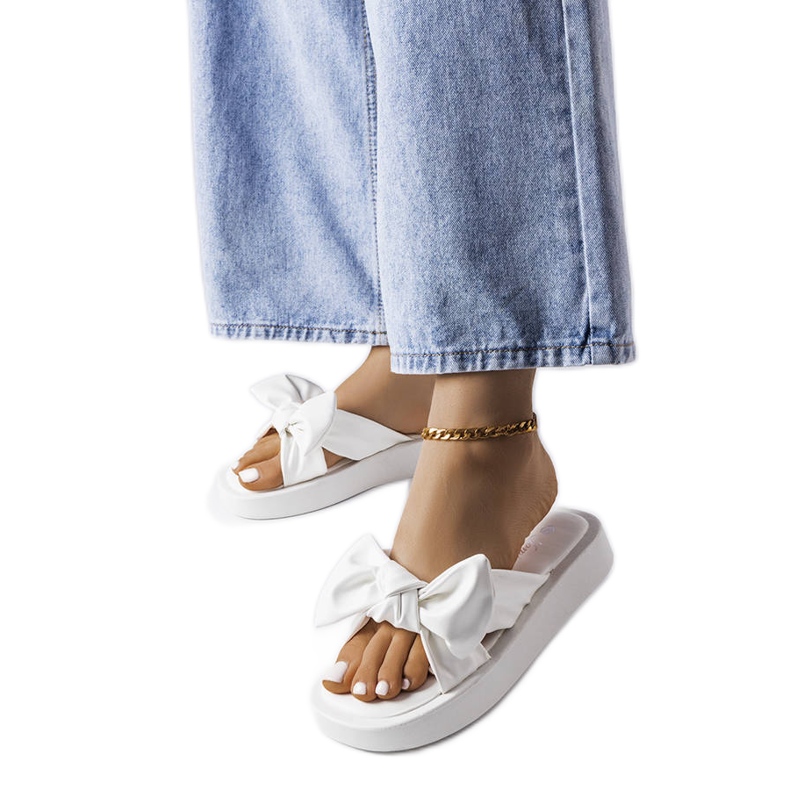 White platform sandals with a bow from Edvard