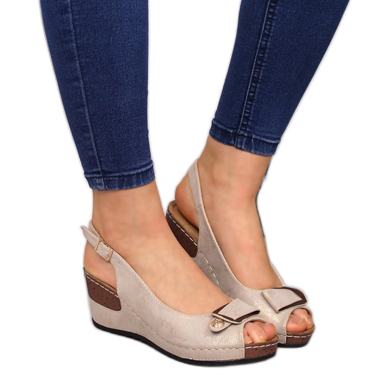 Comfortable women's sandals on a beige wedge with a gloss eVento 6230