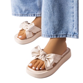 Beige platform sandals with a bow from Edvard