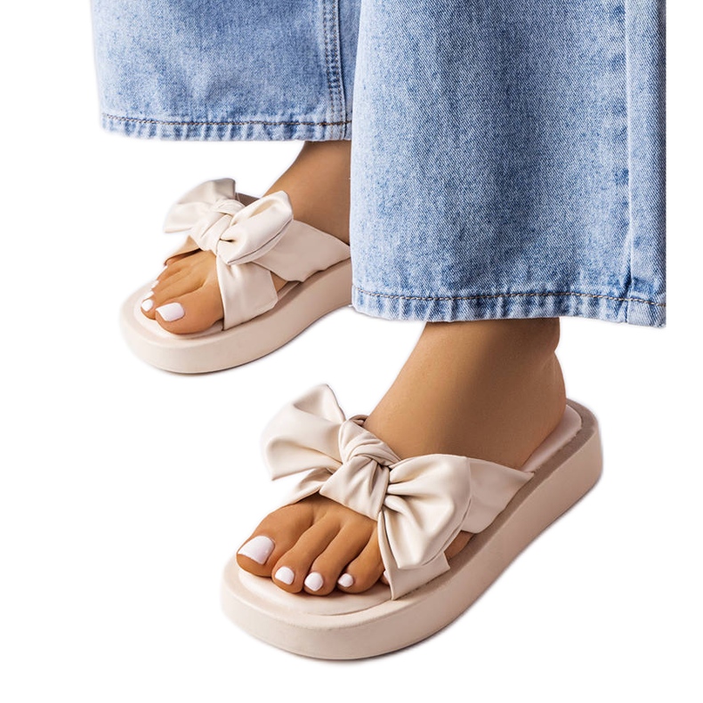Beige platform sandals with a bow from Edvard